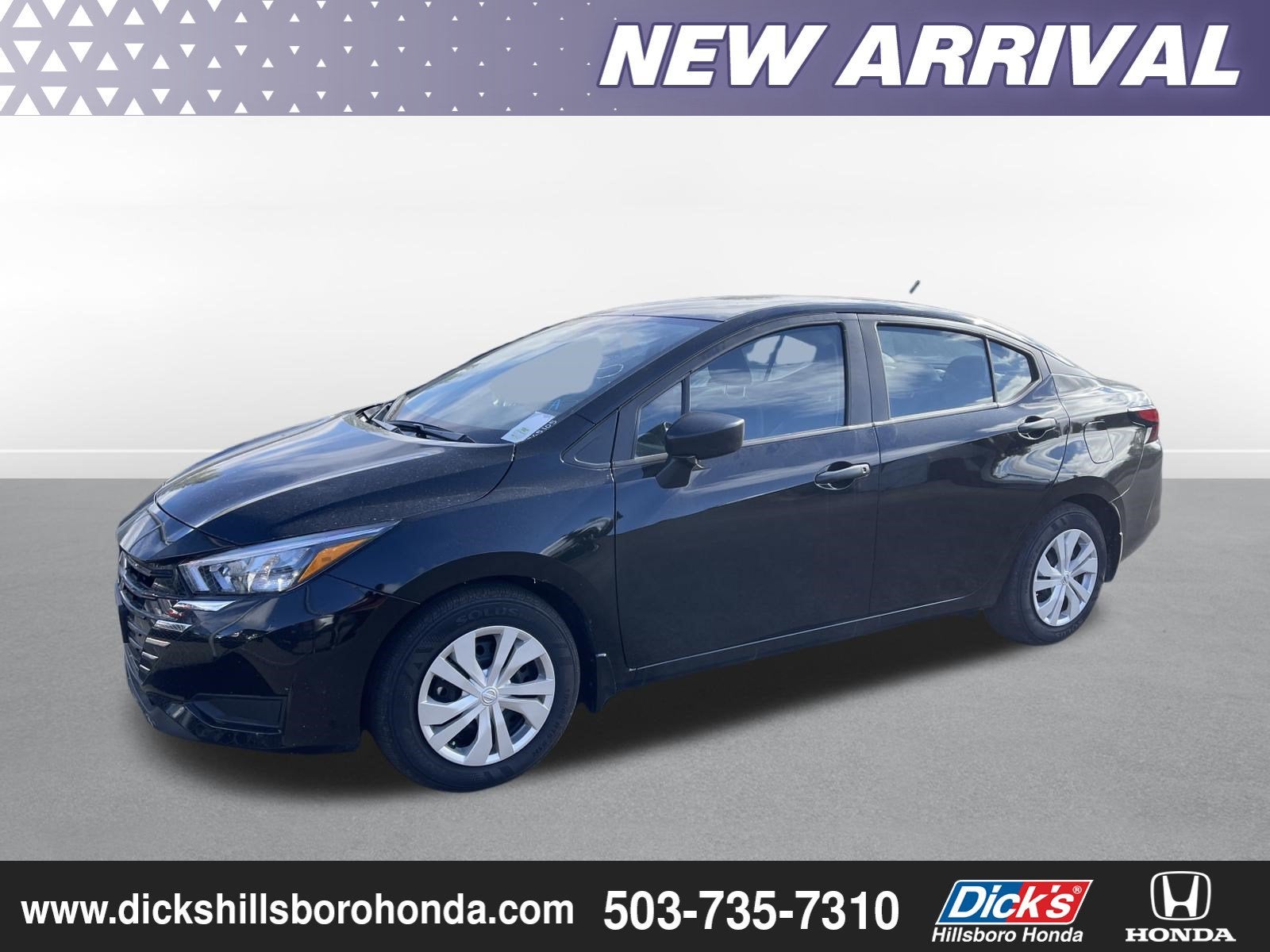 2025 Nissan Versa S in Super Black — front three-quarter view