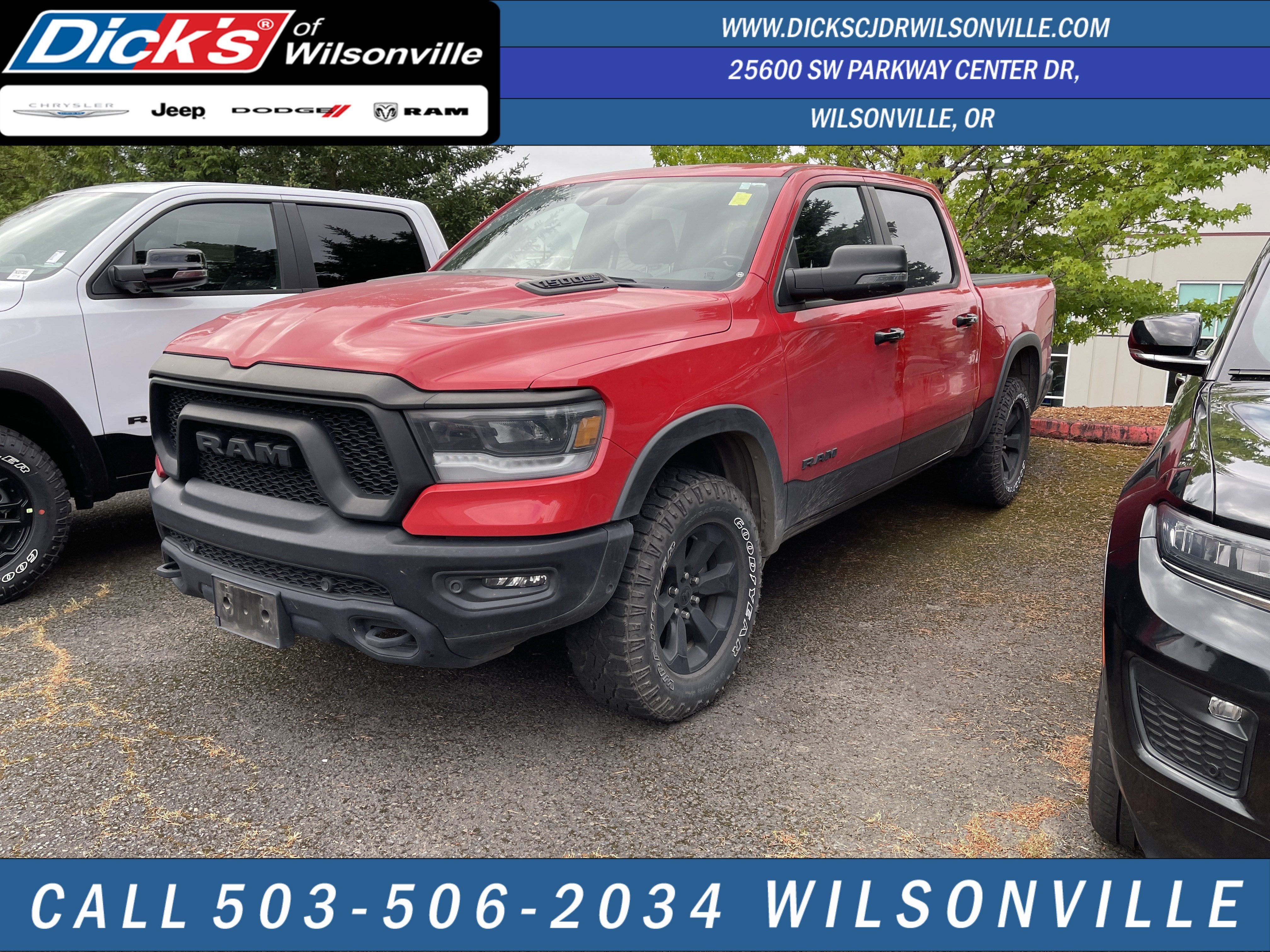 2023 RAM 1500 Rebel in Flame Red Clearcoat — front three-quarter view