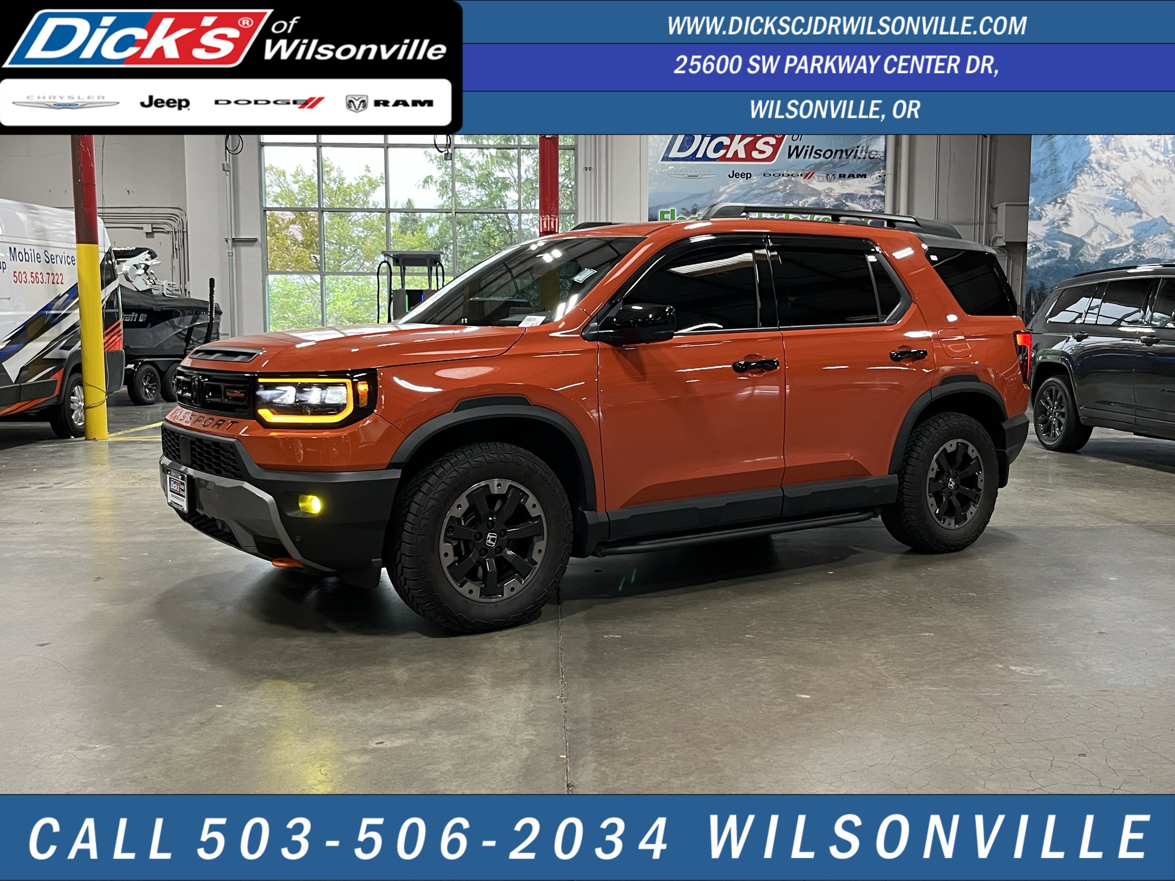 2026 Honda Passport TrailSport Elite in Sunset Orange — front three-quarter view